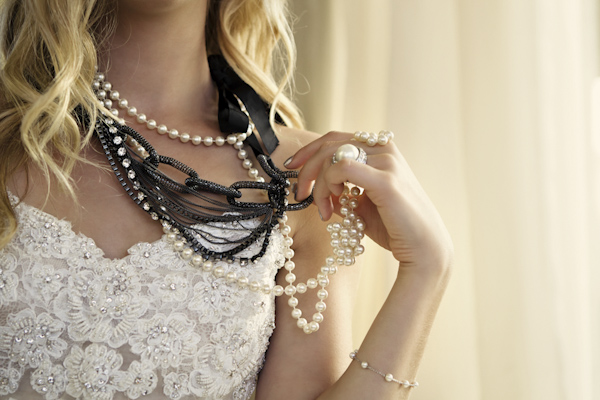 bride holding chain and pearl necklace - wedding photo by top Orange County, California wedding photographers D. Park Photography